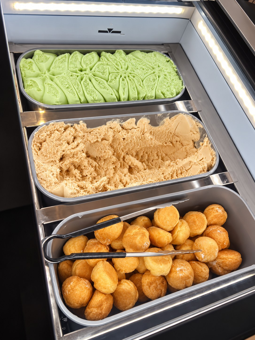 Display with two ice cream flavours and pastries