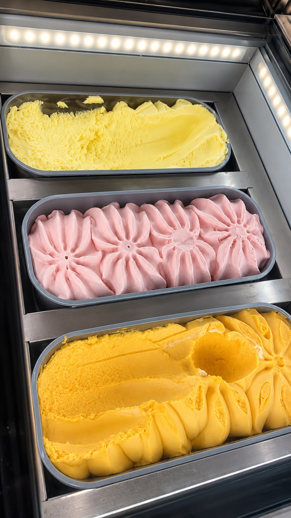 Three different ice cream flavours on display