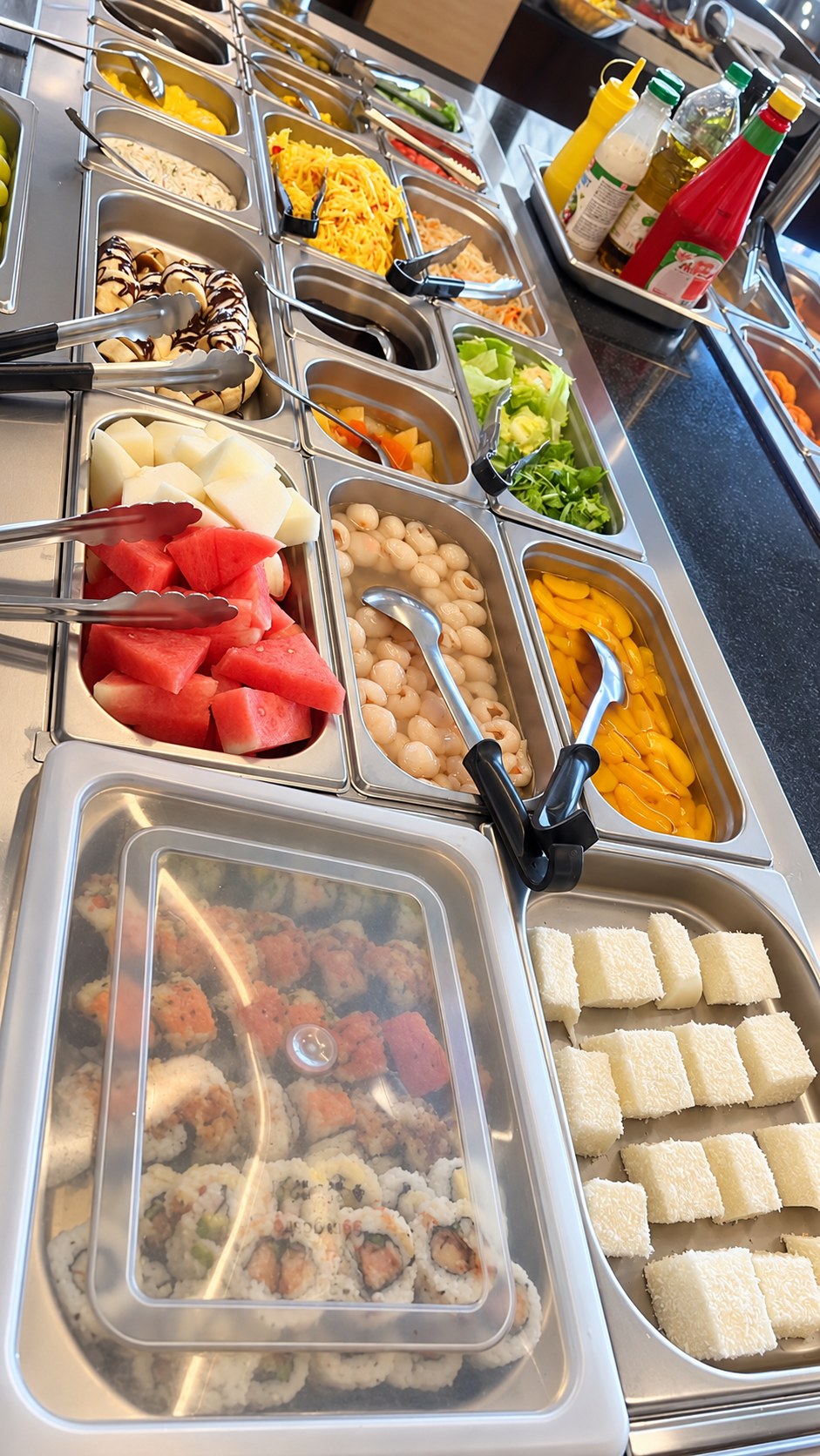 Buffet with melon, fruit and sweet desserts