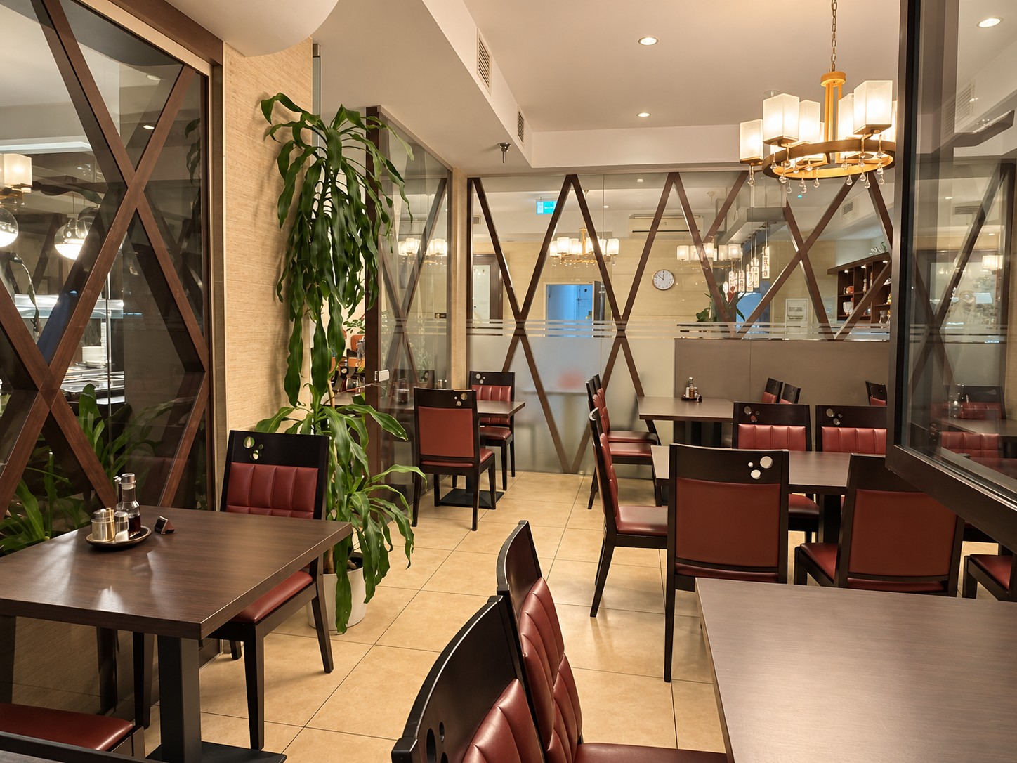Comfortable seating area with upholstered chairs and glass partitions